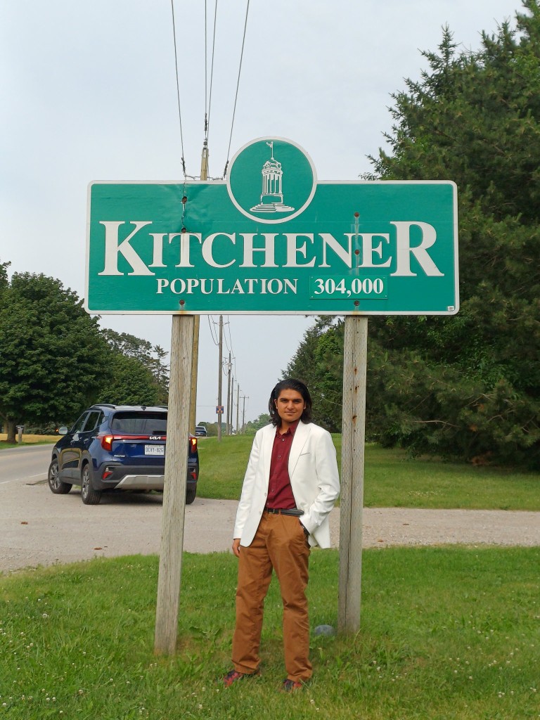 Ibraheem Kappaya at the Welcome to Kitchener sign